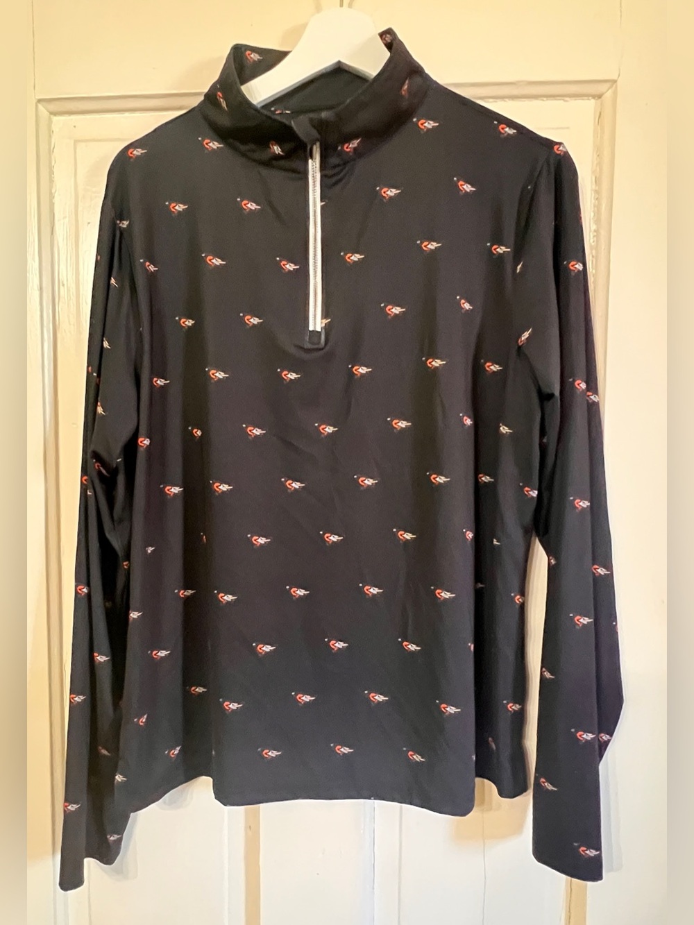 Baltimore Orioles Black Long Sleeve Half-Zip Top with Orange/White Micro Print.